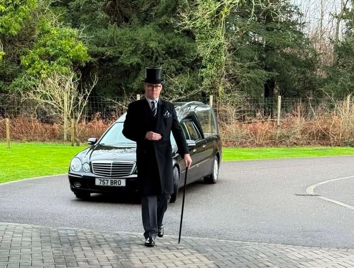 Jason Corbin, funeral director, in top hat and tails
